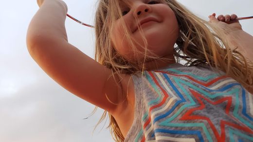 Child celebrating wearing a star shirt